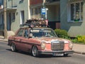 Old veteran classic very rusty scrap sedan car Mercedes Benz driving