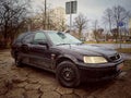 Old classic veteran black hatchback car Honda Civic 1.8 parked