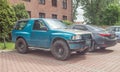 Old classic veteran blue 4wd offroad car Opel Frontera two doors with big massive solid black bumper parked