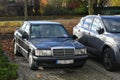 Old classic veteran German black sedan car Mercedes Benz W201 or 190 2.0 litre diesel parked