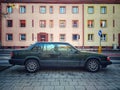 Old classic veteran grunge big heavy dark green Swedish Volvo 940 or Polar sedan car parked Royalty Free Stock Photo