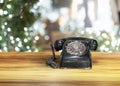 Old classic vintage dial telephone on wooden table Royalty Free Stock Photo