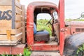 Old classic vintage tractor truck in red with open door used as a photography prop at a farm festival Royalty Free Stock Photo