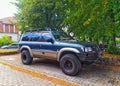 Old classic vintage veteran dark blue 4WD car Nissan patrol 3.0 right side and front view