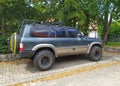 Old classic vintage veteran dark blue 4WD car Nissan patrol 3.0 right side and rear part view Royalty Free Stock Photo