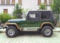 Old classic vintage veteran dark green allroad 4WD car Jeep Wrangler left side view Royalty Free Stock Photo