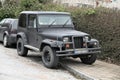 Black matte classic vintage look American car Jeep Wrangler parked Royalty Free Stock Photo