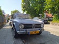 Old classic vintage veteran sedan Italian car Alfa Romeo Giulia 1300 TI right side and front logo grille Royalty Free Stock Photo