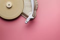 Old classic vinyl record player on pink pastel background Royalty Free Stock Photo