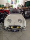 Old white classic sport 1960 Austin Healey Sprite roadster car indoors