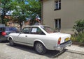 Old classic vintage veteran sedan Italian car Fiat 124 Sport Coupe CC left side and rear part parked Royalty Free Stock Photo