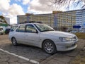 Old classic white popular French car Peugeot 306 parked