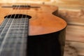 Old classical guitar on wooden background Royalty Free Stock Photo