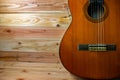 Old classical guitar on wooden background Royalty Free Stock Photo