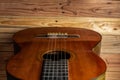 Old classical guitar on wooden background Royalty Free Stock Photo