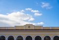 Old classy architecture building facade with arched doors against blue sky. Athens, Monastiraki station Royalty Free Stock Photo