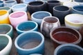 Old clay colorful pots on wooden floor Royalty Free Stock Photo