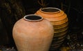 Old clay jar on dark shadow background Royalty Free Stock Photo