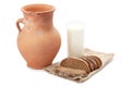 Old clay jug, a glass of milk and bread Royalty Free Stock Photo