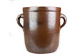 Old clay pot for storing food. Kitchen accessories on a white table Royalty Free Stock Photo