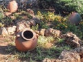 Old clay pots on the background of grass and stones Royalty Free Stock Photo