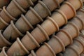 Old clay pots in layers. Traditional gardening tool