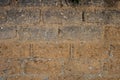 Old clay wall with bricks pattern and mixed pebbles Royalty Free Stock Photo