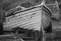 An old clinker built wooden working fishing boat on a trailer