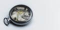 Old clock without a dial with cracked glass on a white gradient background. Gear wheels, pulleys. Macro photography. Full focus. Royalty Free Stock Photo