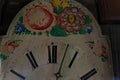 Old clock disc with flower ornaments. Royalty Free Stock Photo