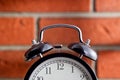 Old clock in front of a brick wall Royalty Free Stock Photo