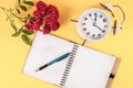 Vintage Retro Clock and Red Rose on Blank Notebook: A Timeless Inspiration Royalty Free Stock Photo