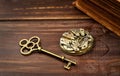Old clockwork and key, escape room game background Royalty Free Stock Photo