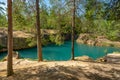 Old closed down mine with crystal clear turquoise water