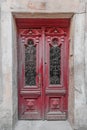 Old closed vintage shabby red wooden door of the 19th century Royalty Free Stock Photo