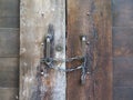 Old closed wooden door with chain and padlock Royalty Free Stock Photo