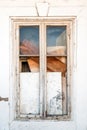 Old closed wooden window with broken glass Royalty Free Stock Photo