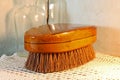 OLD CLOTHES BRUSH WITH SMALL GLASS BOTTLES Royalty Free Stock Photo