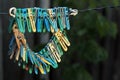 Old clothes pegs hanging on a rope Royalty Free Stock Photo