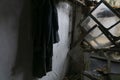 An old clothes and rusty elements inside an abandonated house at Chernobyl