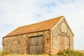 Old coal barn. Thornham Old Harbour, England, UK. Royalty Free Stock Photo