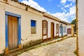 Old cobbled street with houses in colonial architecture Royalty Free Stock Photo