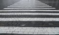 Old cobblestone pavement closeup and white line