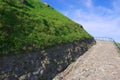 Old cobblestone road going uphill in Vilnius, Lithuania. Royalty Free Stock Photo