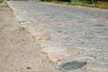 Old cobblestone road paved with stones Royalty Free Stock Photo