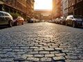 Old cobblestone street with cars parked along the curb in the Tribeca neighborhood of Manhattan in New York City Royalty Free Stock Photo