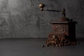 Old coffee grinder and coffee beans Royalty Free Stock Photo