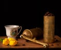 Old coffee grinder with cup and coffee beans Royalty Free Stock Photo