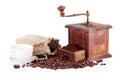 Old coffee grinder and cup of coffee. Royalty Free Stock Photo