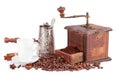 Old coffee grinder, kettle and cup of coffee. Royalty Free Stock Photo